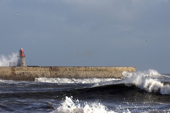 Waves breaking over South Shields Lighthouse, River Tyne