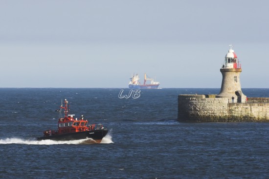 Tyne Pilot Boat passing South Shields Lighthouse, River Tyne